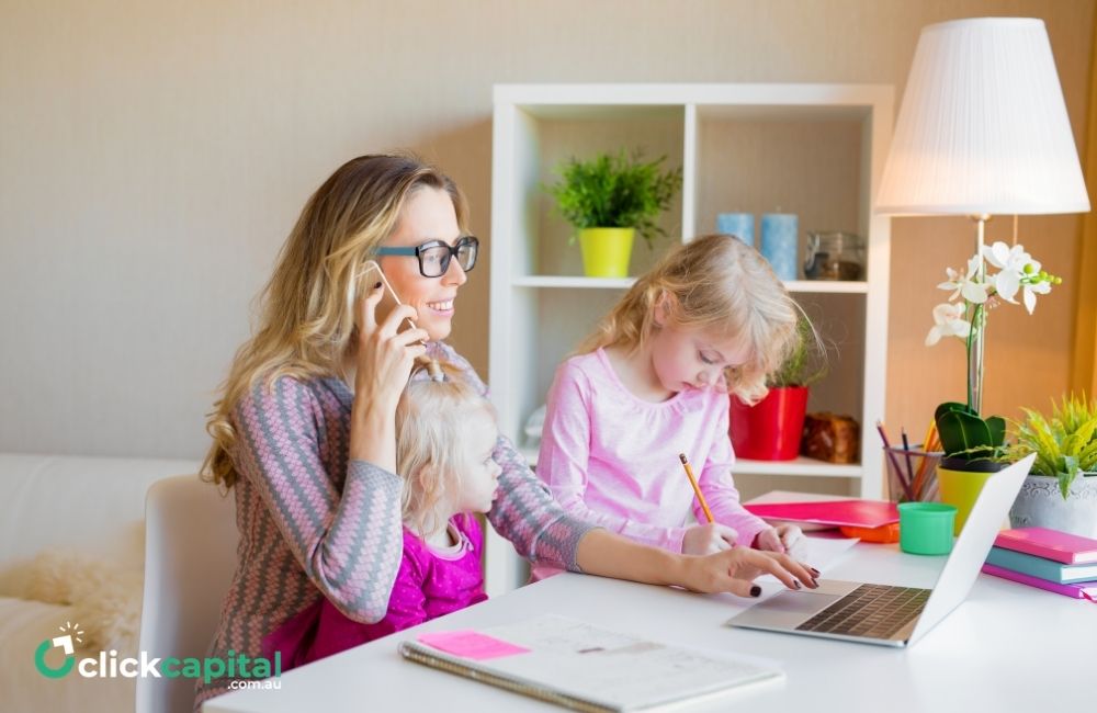 mom with daughters working from home