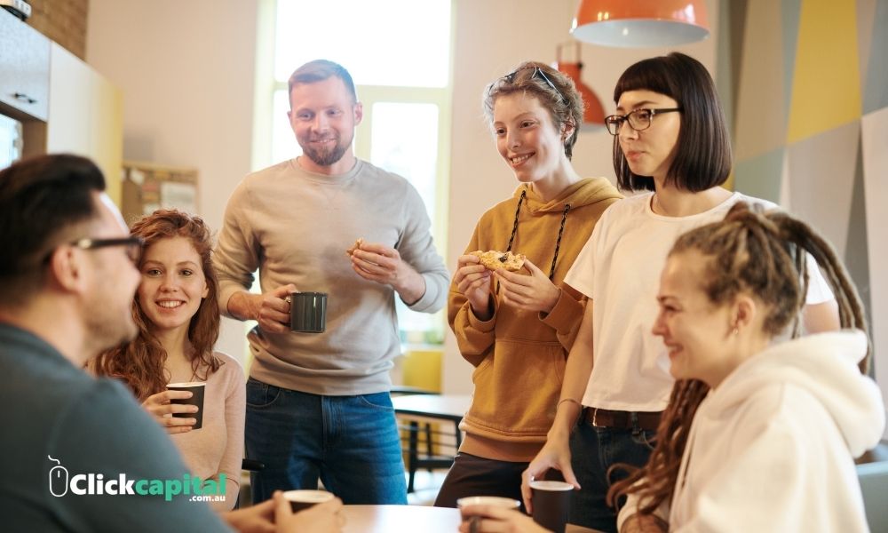 business owner talking with his employees in the pantry