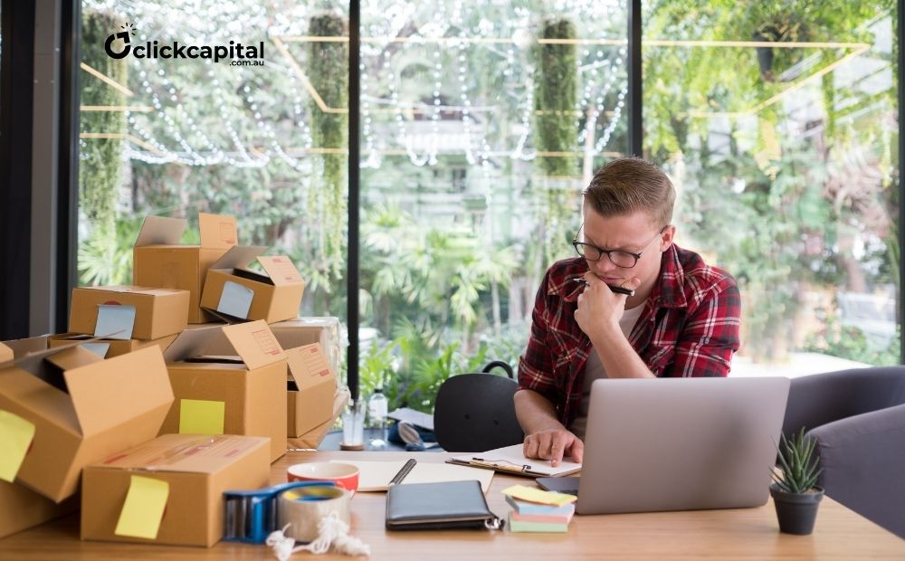 frustrated man reviewing his cash flow for his small business at his workplace