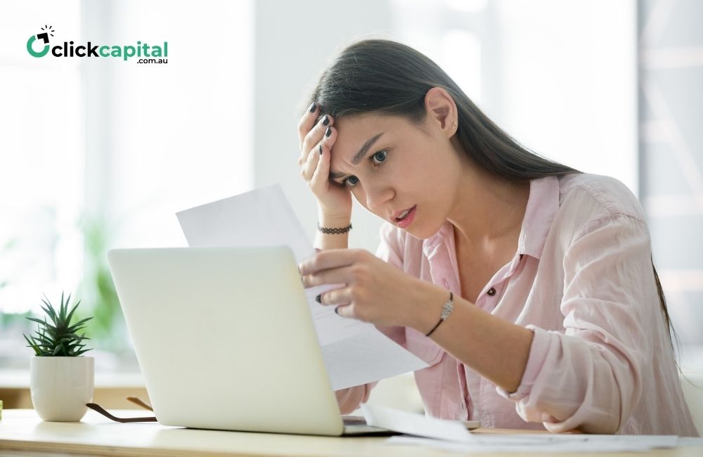 Worried frustrated woman looking at unpaid invoices