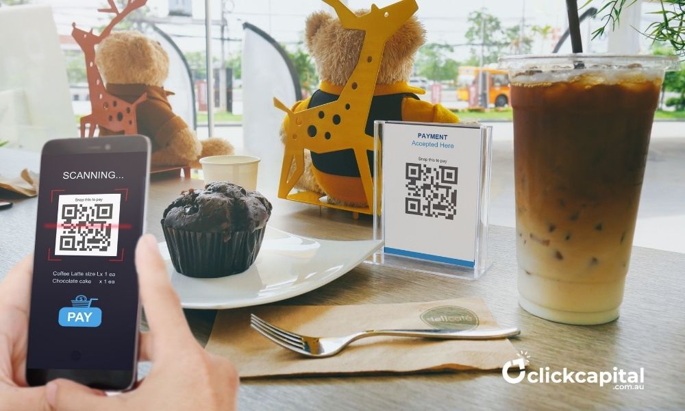 man scanning qr code for cashless payment in a cafe