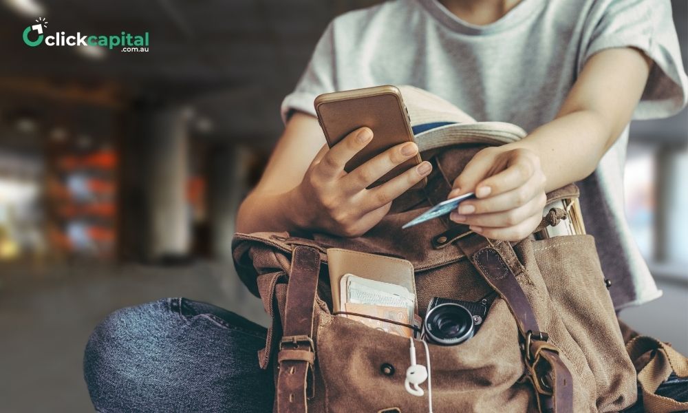 traveler paying with credit card on her  smart phone