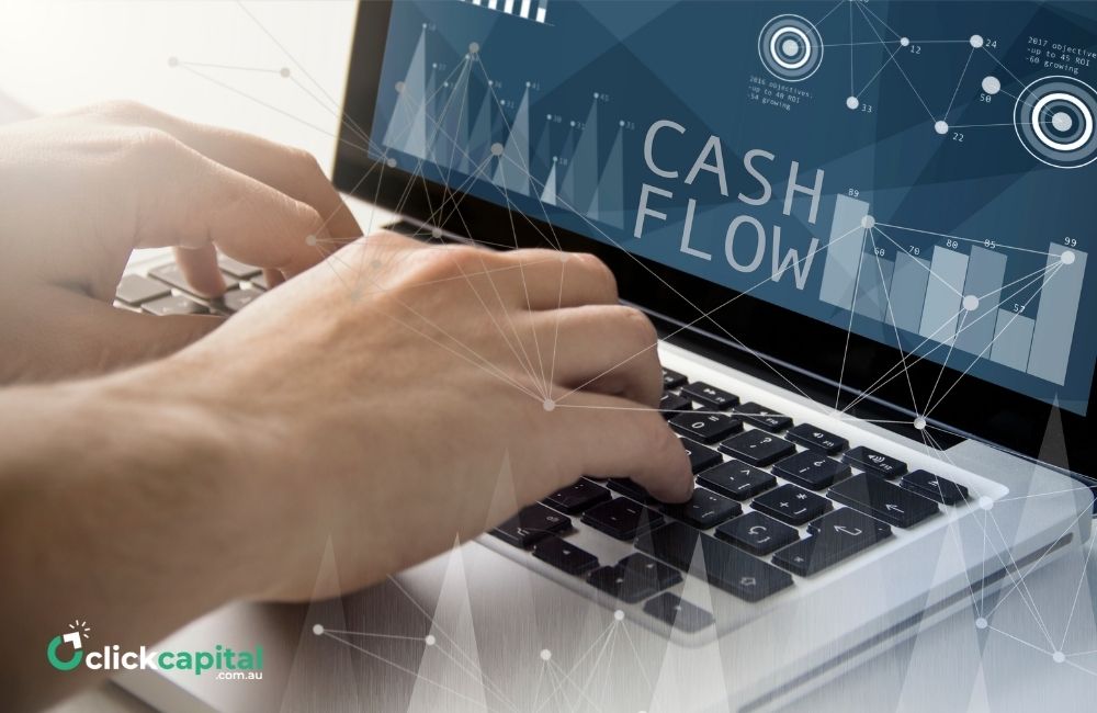 cash flow concept. hands typing on laptop displaying cash flow