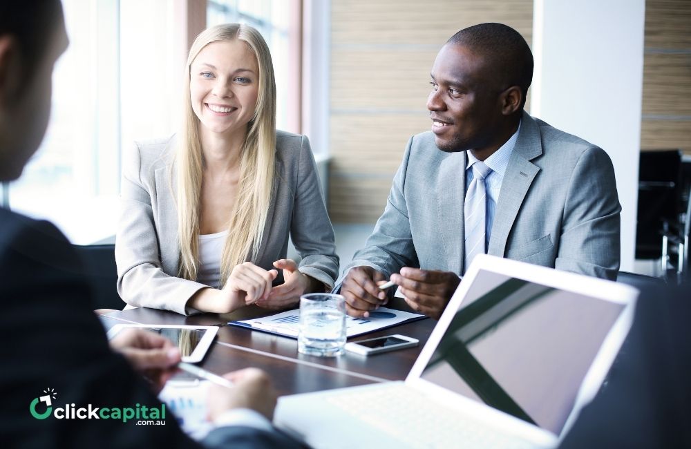 happy business owners talking in the office