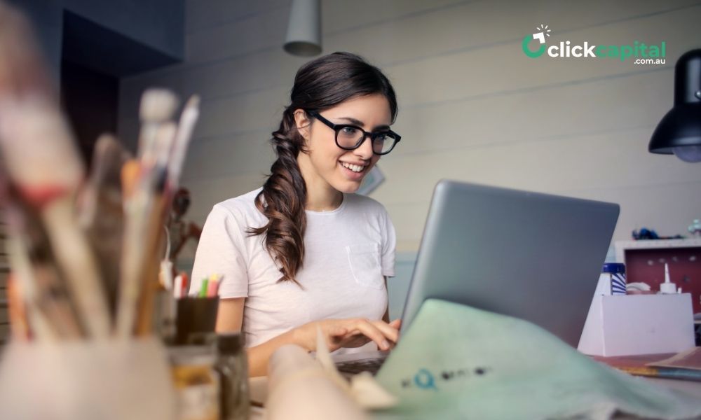 business woman comparing loans on laptop in the office