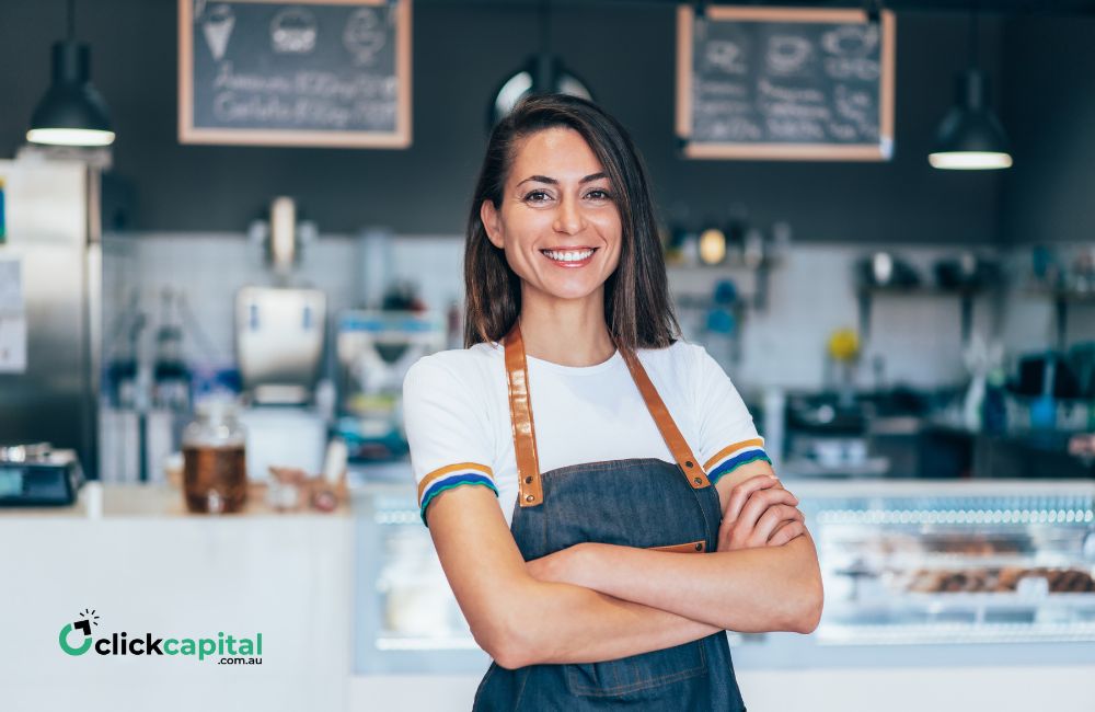 female business owner smiling in her cafe