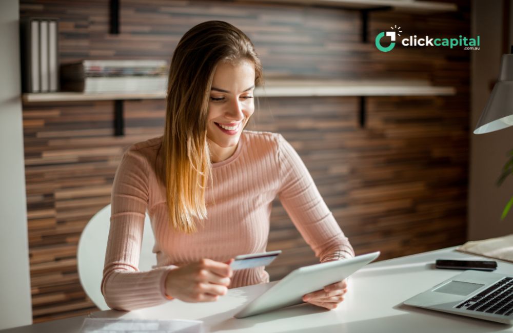 happy young business woman doing a credit check online