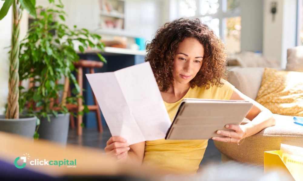 female business owner reading about cash flow finance on her tablet