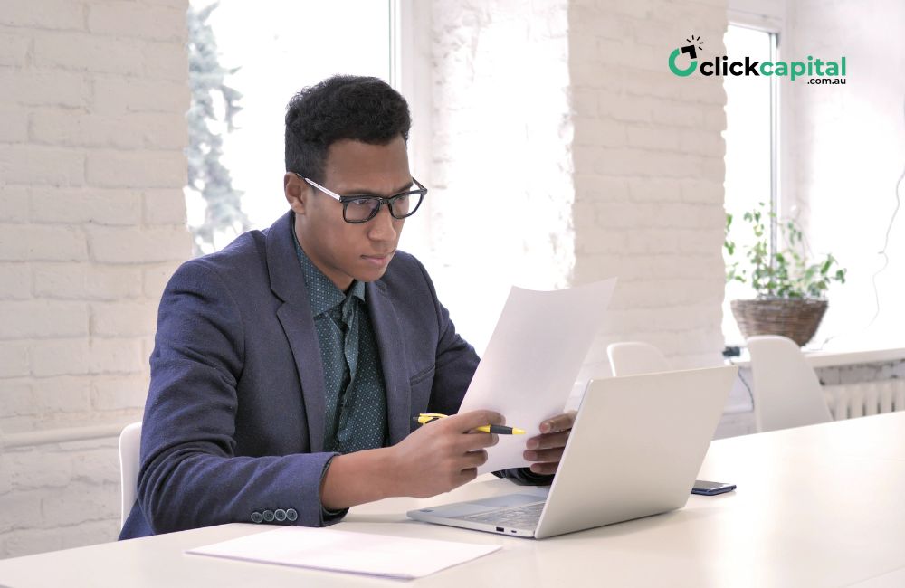 business man reading documents for credit assessment